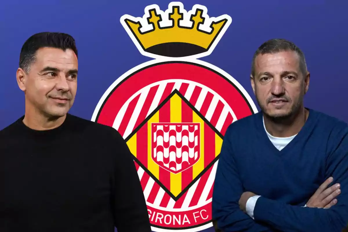 Dos hombres posan frente al escudo del Girona FC.