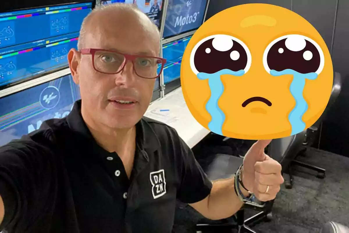 Man with red glasses and a black DAZN t-jersey in a monitor room, giving a thumbs-up gesture while a large crying face emoji covers part of the image.