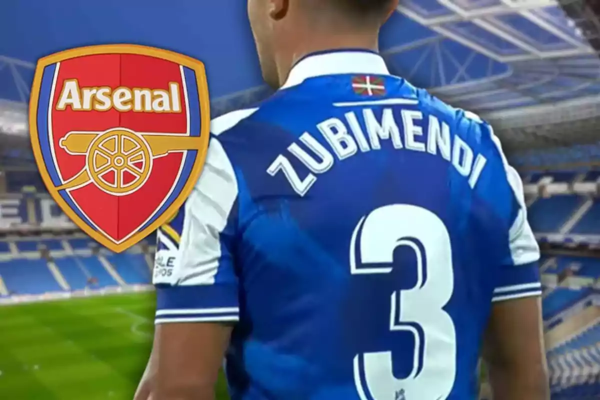 Jugador de fútbol con la camiseta de la Real Sociedad y el nombre Zubimendi junto al escudo del Arsenal en un estadio. Jugador de fútbol con la camiseta de la Real Sociedad y el nombre Zubimendi junto al escudo del Arsenal en un estadio.