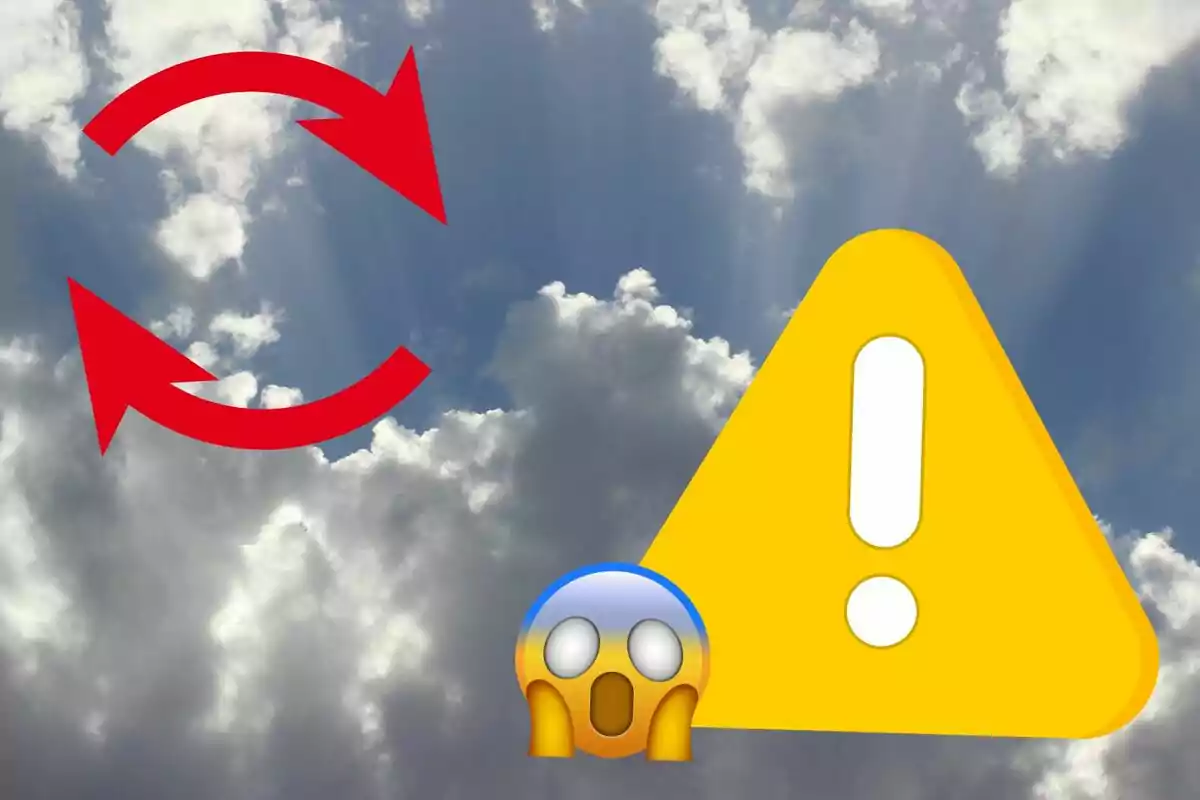 Núvols al cel amb fletxes vermelles de recàrrega, un triangle d’advertència groc i un emoji de sorpresa