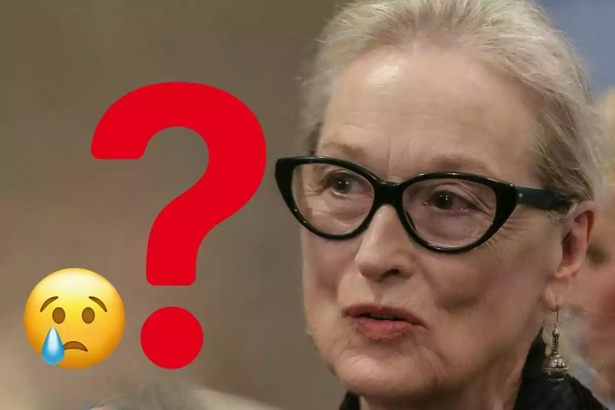 Meryl Streep con gafas oscuras con un gran signo de interrogación rojo y un emoji de carita triste con lágrima