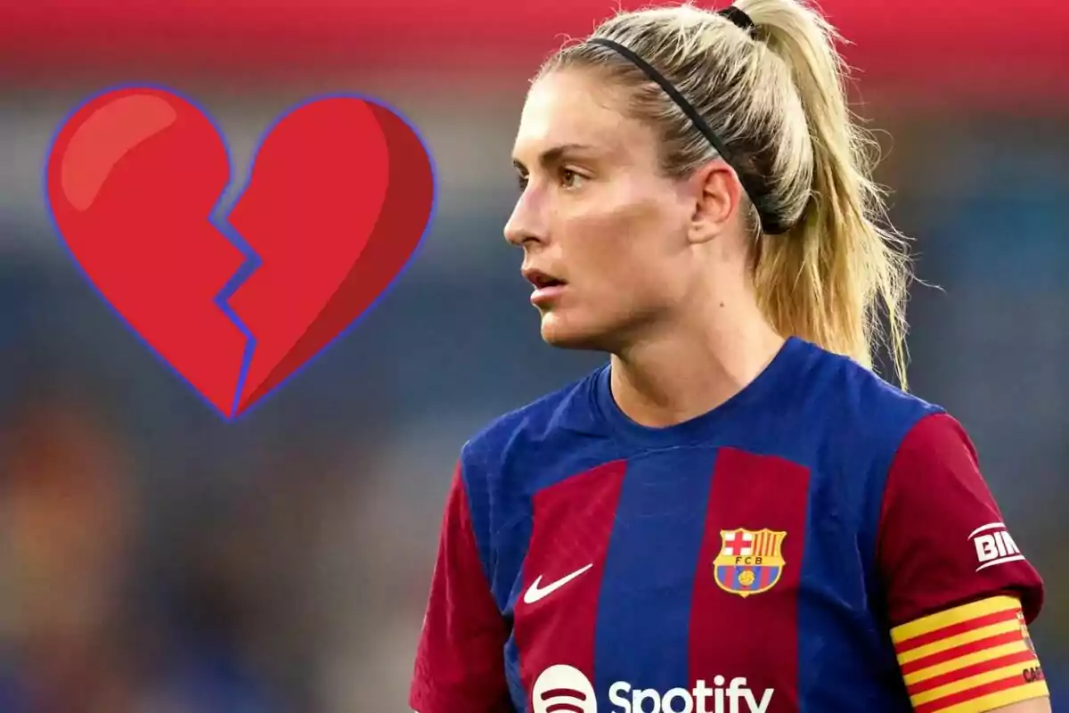 Futbolista del Barcelona femení amb gest seriós i un cor trencat dibuixat al seu costat
