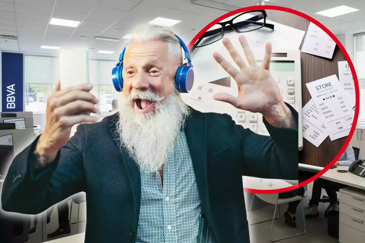 Home gran amb barba i auriculars blaus somriu mentre sosté un telèfon mòbil en una oficina bancària amb el logotip de BBVA i un cercle que mostra una calculadora, ulleres i rebuts sobre una taula.