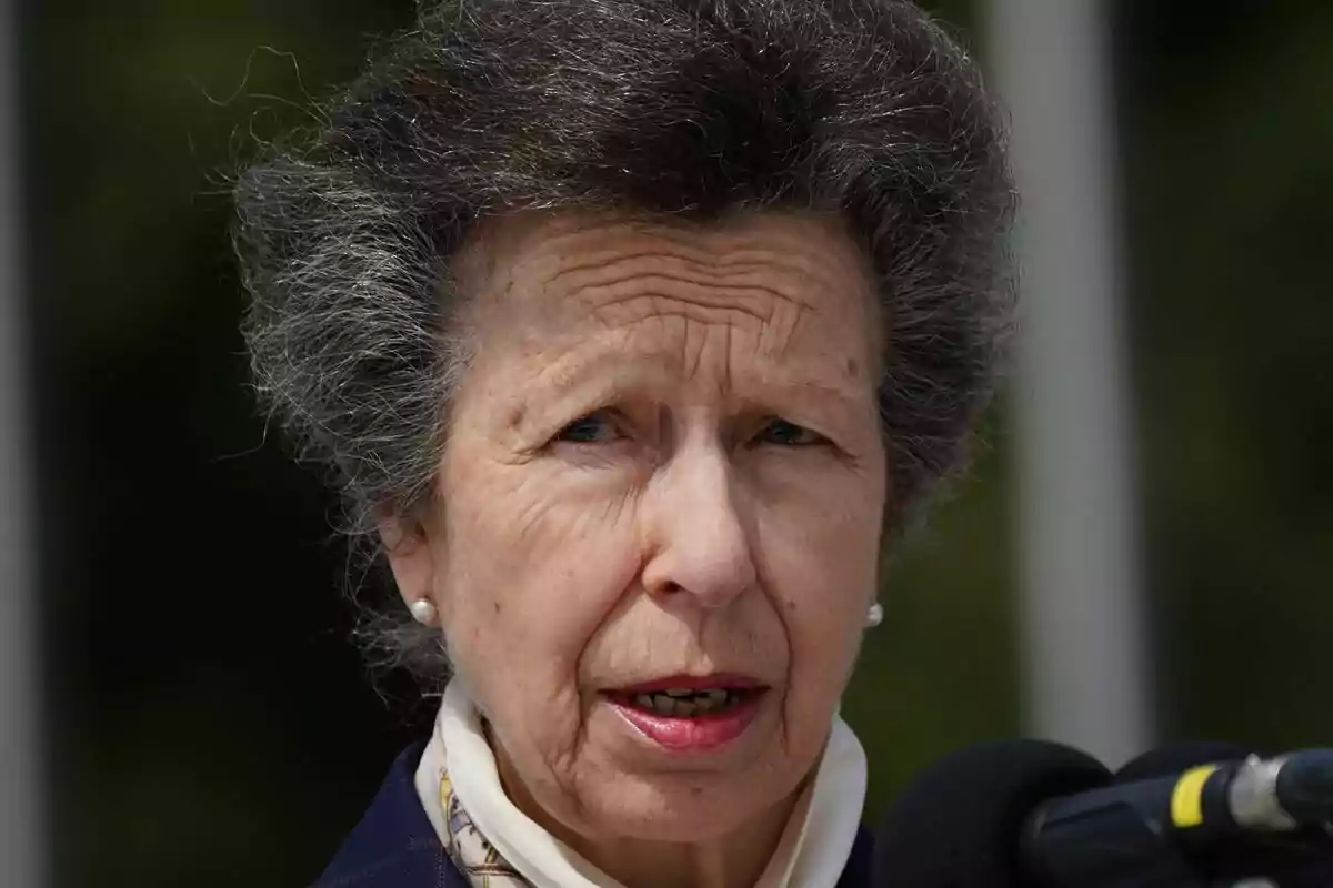Princess Anne speaking in front of a microphone outdoors Princess Anne speaking in front of a microphone outdoors