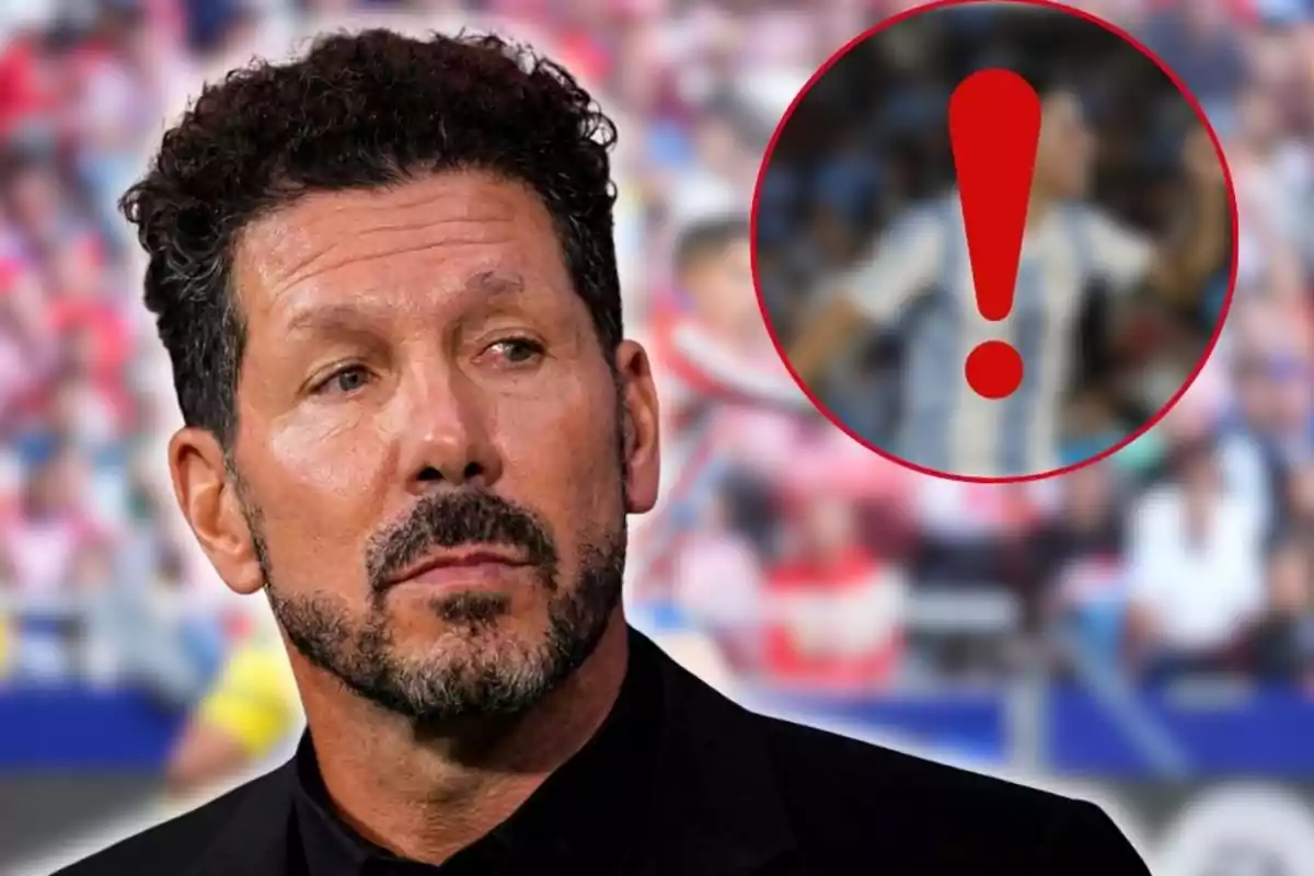 Hombre de cabello rizado y barba con expresión seria en primer plano, al fondo un círculo rojo con un signo de exclamación sobre una figura desenfocada