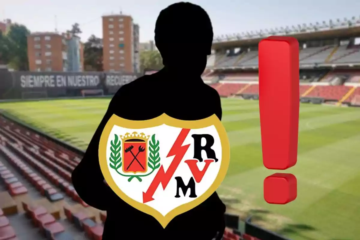 Silueta de una persona con el escudo del Rayo Vallecano y un signo de exclamación rojo en un estadio de fútbol