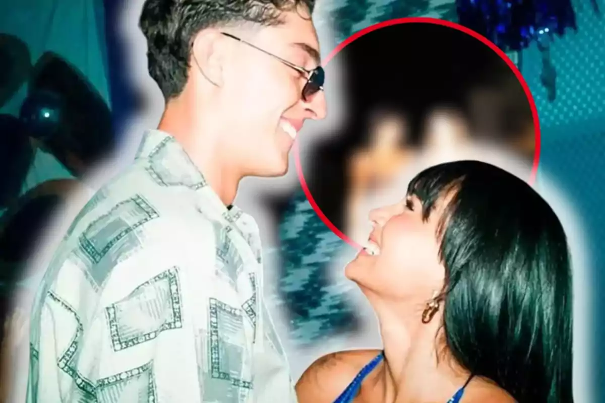 A couple smiles at each other up close in a festive setting with lights and decorations in the background, while a red circle highlights a blurred area behind them.
