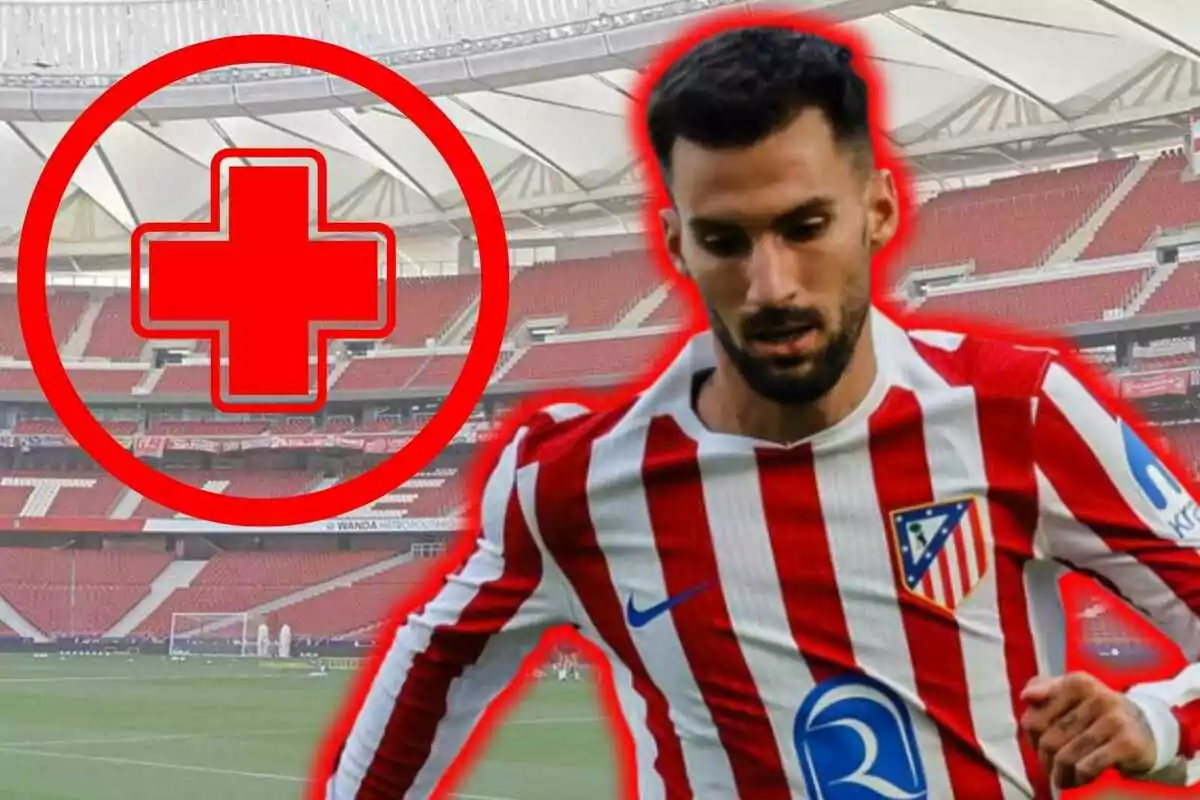 Futbolista del Atlético de Madrid con uniforme rojiblanco en primer plano y un símbolo de cruz roja grande al fondo en un estadio vacío