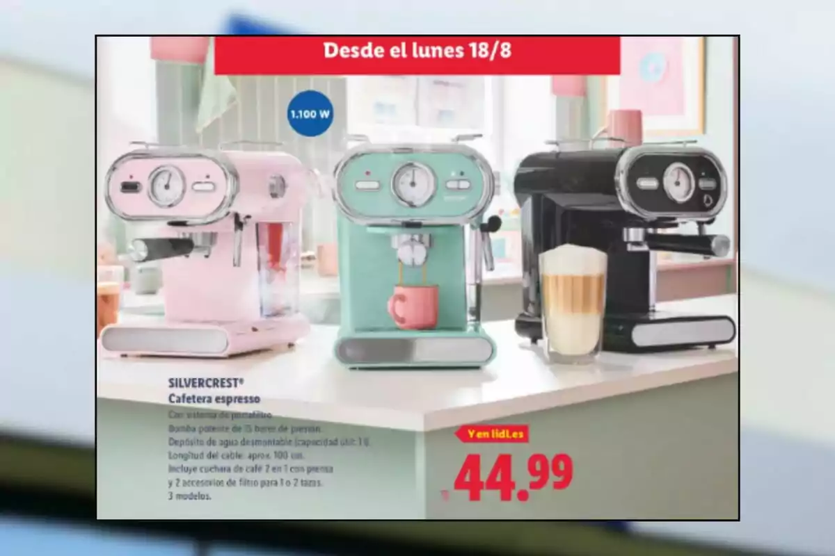 Three espresso machines in pink, green, and black displayed on a white table, with a cup and a glass of coffee in front, next to a sign showing the price and product features. Three espresso machines in pink, green, and black displayed on a white table, with a cup and a glass of coffee in front, next to a sign showing the price and product features.
