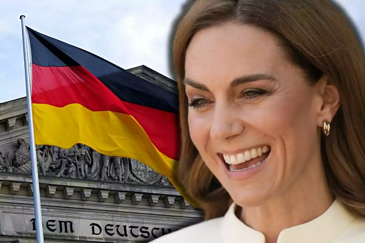 Kate Middleton smiling in the foreground next to a German flag waving in front of a historic building.
