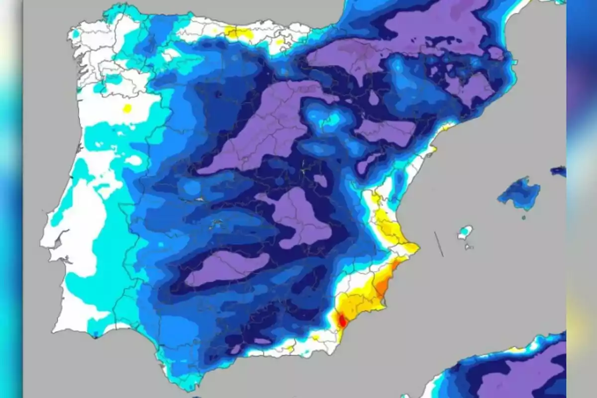 Mapa de la península Ibèrica amb diferents colors que representen nivells de precipitacions o temperatures, destacant zones en blau, morat, groc i vermell Mapa de la península Ibèrica amb diferents colors que representen nivells de precipitacions o temperatures, destacant zones en blau, morat, groc i vermell