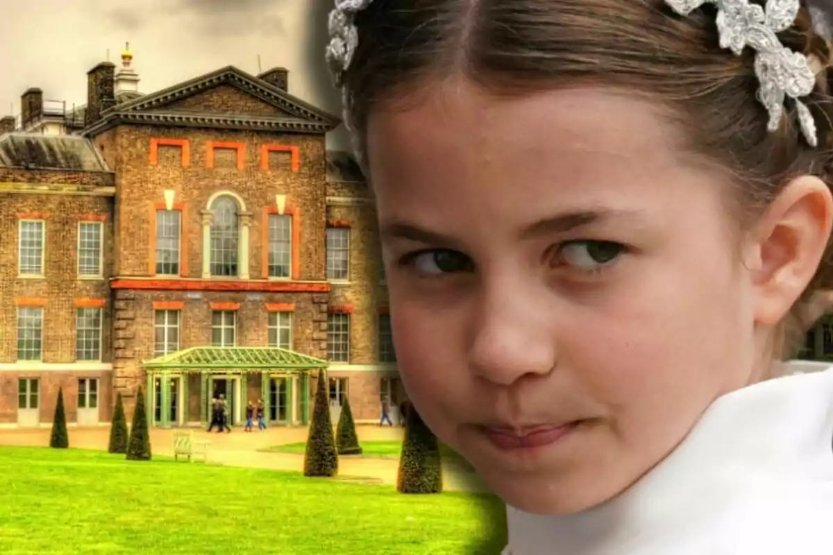 Princess Charlotte with a serious expression and a white headband in her hair in front of an old brick building with large windows and a green garden