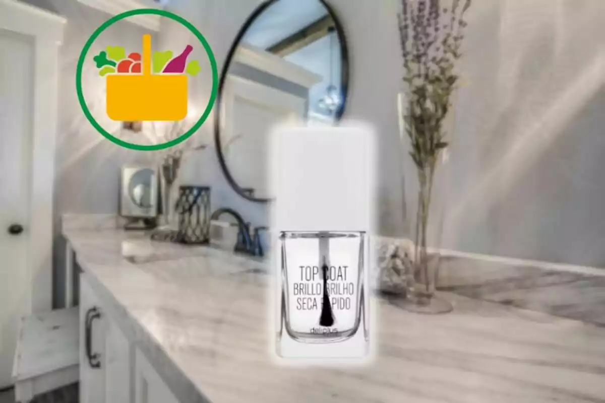 Flascó d’esmalt transparent amb tapa blanca sobre un tocador de bany amb mirall rodó i decoració; a la cantonada superior esquerra hi ha una icona de cistella de la compra amb aliments. Flascó d’esmalt transparent amb tapa blanca sobre un tocador de bany amb mirall rodó i decoració; a la cantonada superior esquerra hi ha una icona de cistella de la compra amb aliments.