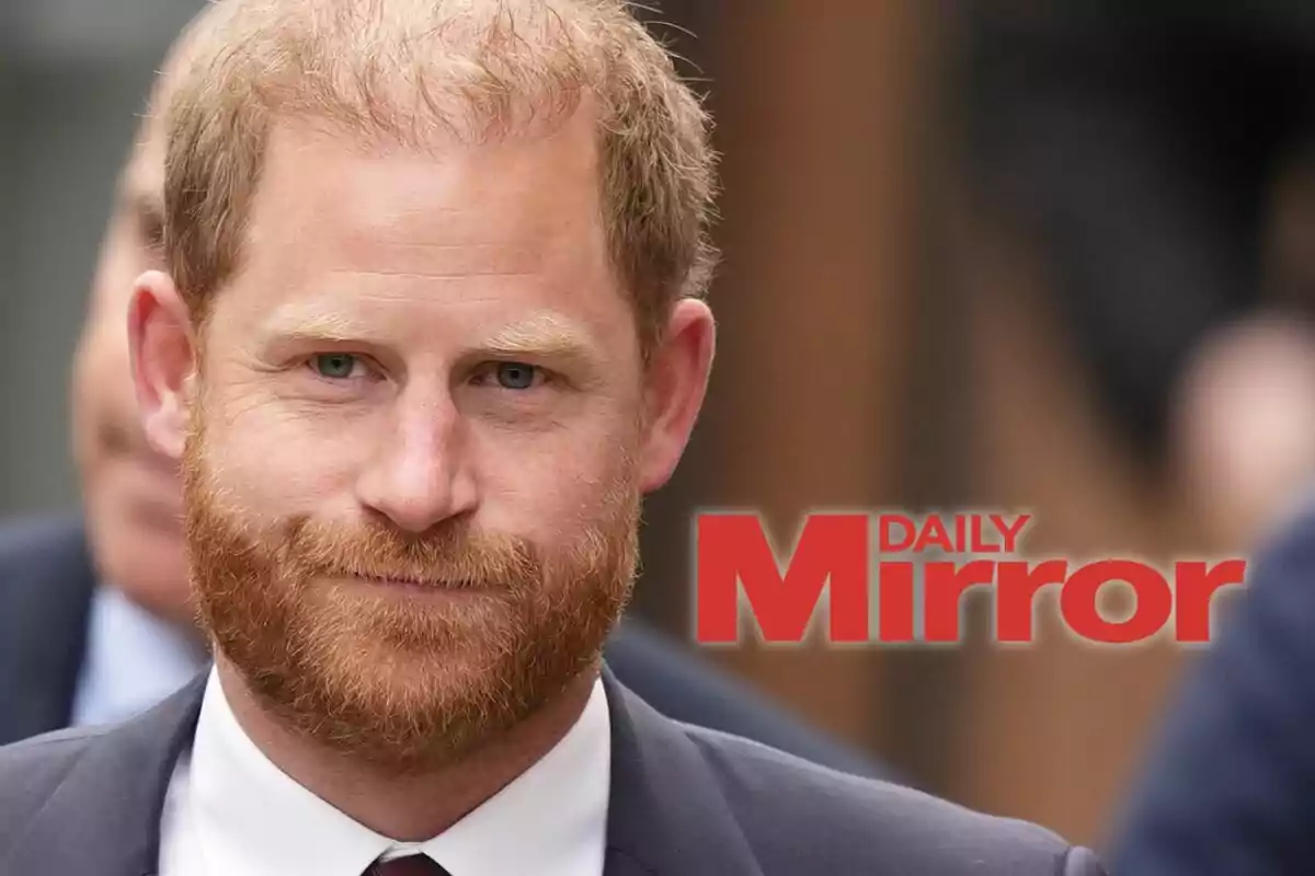 Prince Harry in a dark suit in the foreground with the Daily Mirror logo in red letters
