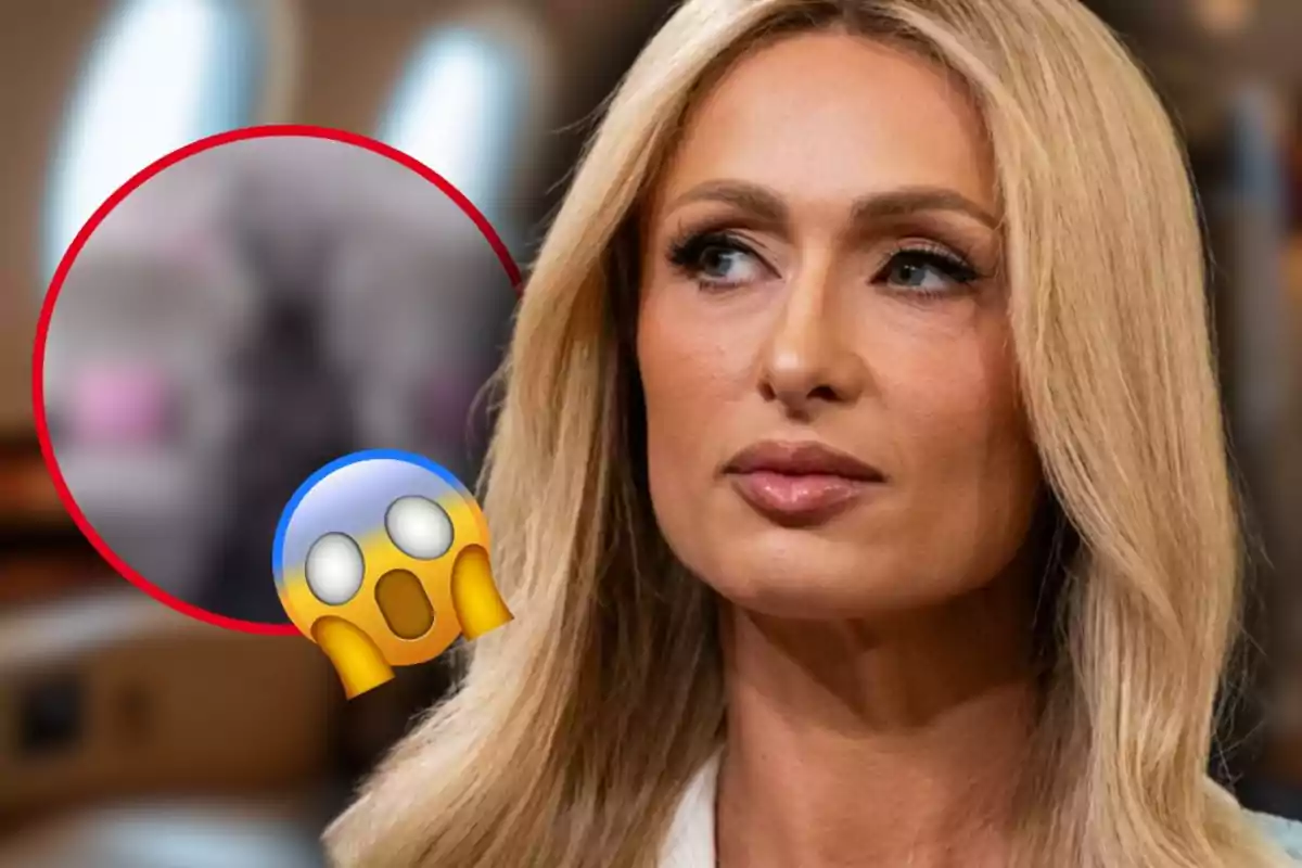 Mujer rubia de expresión seria en primer plano con un círculo borroso y un emoji de sorpresa en la esquina izquierda de la imagen