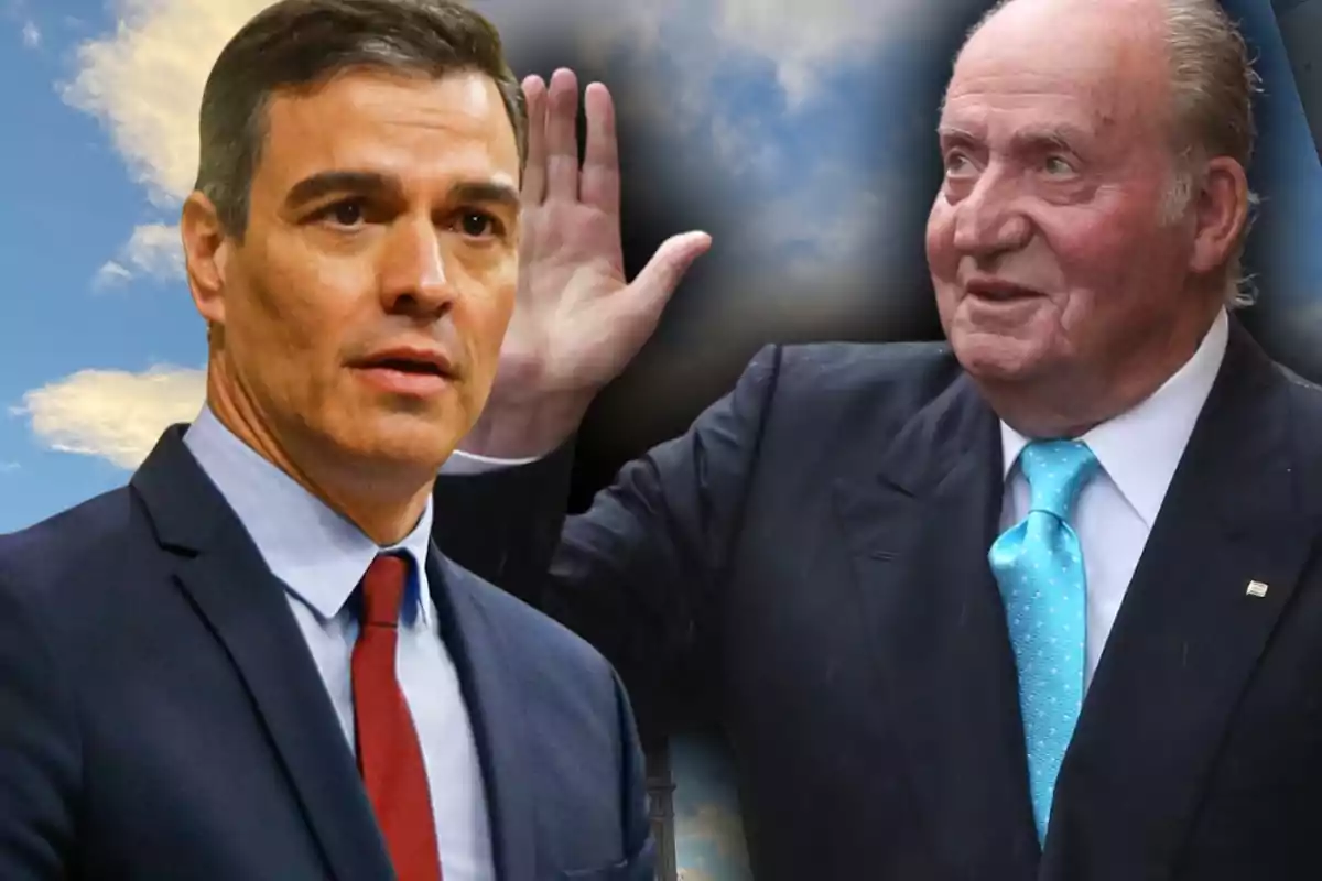 Dos homes amb vestit posen davant d’un fons de cel amb núvols; un d’ells saluda aixecant la mà.