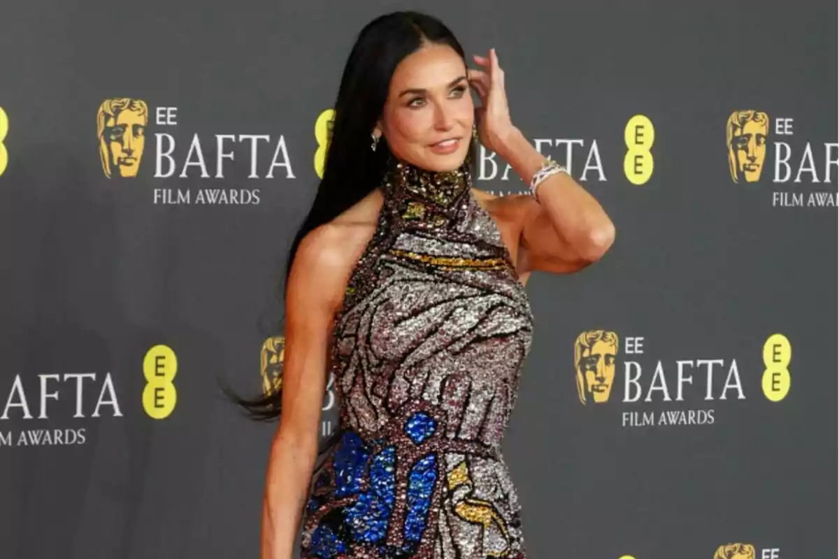 Demi Moore in a sparkling dress posing on the BAFTA Awards red carpet Demi Moore in a sparkling dress posing on the BAFTA Awards red carpet