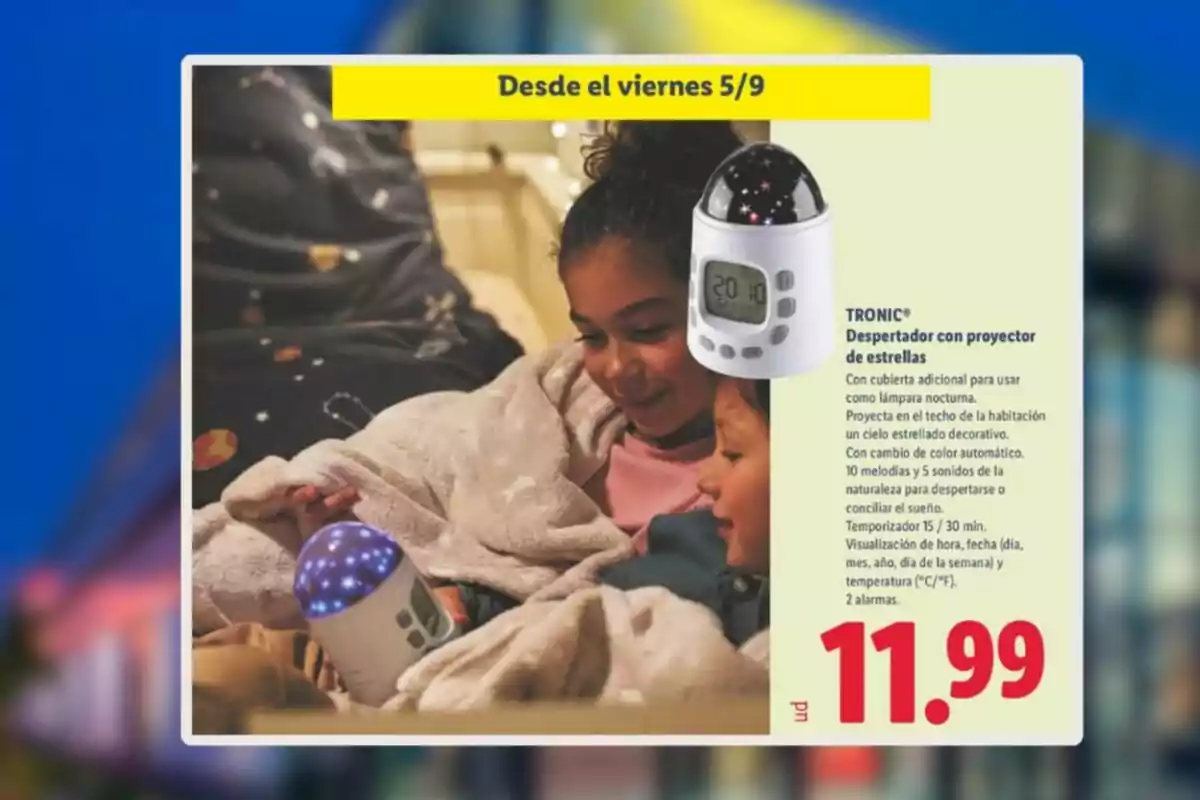 Two children smile as they look at a star projector alarm clock that lights up with blue lights, next to a promotion showing a price of .99 and the sale start date. Two children smile as they look at a star projector alarm clock that lights up with blue lights, next to a promotion showing a price of .99 and the sale start date.