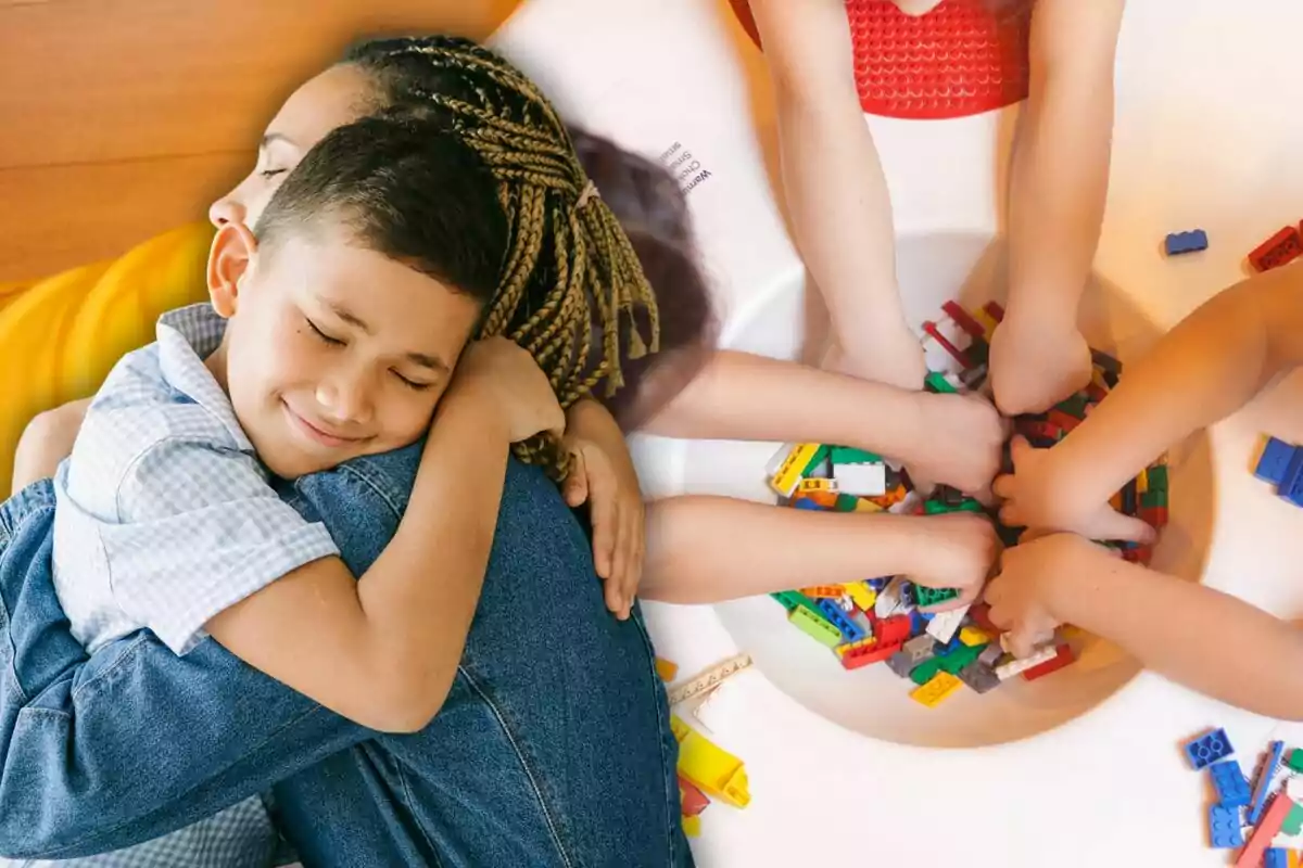 Niño abrazando a una mujer mientras varios niños juegan con bloques de construcción Niño abrazando a una mujer mientras varios niños juegan con bloques de construcción