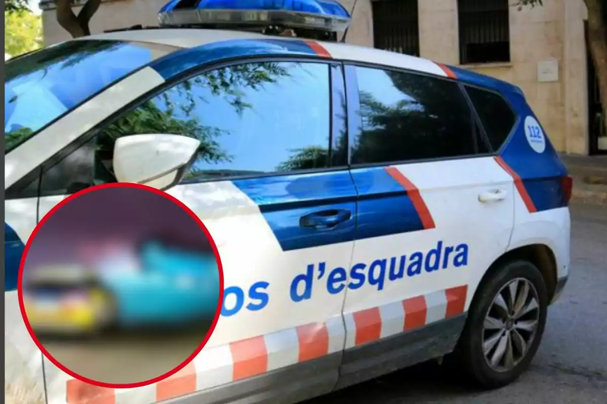 Un cotxe dels Mossos d'Esquadra amb un cercle vermell ressaltant una àrea borrosa.