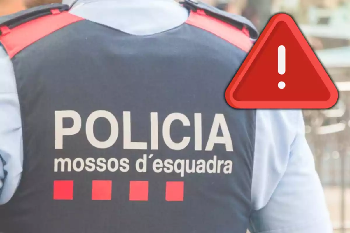 Agent dels Mossos d'Esquadra amb una icona d'advertència vermella