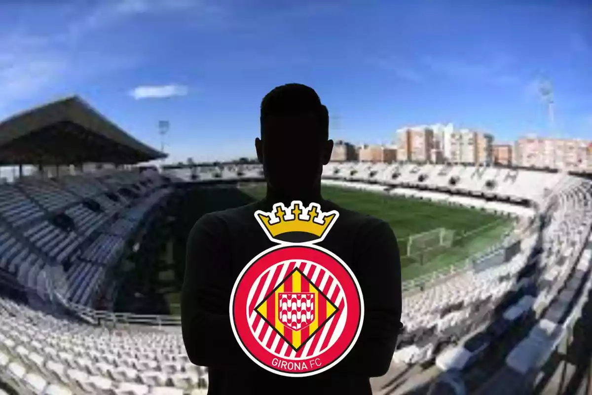 A dark silhouetted person holding the Girona FC crest in an empty football stadium. A dark silhouetted person holding the Girona FC crest in an empty football stadium.