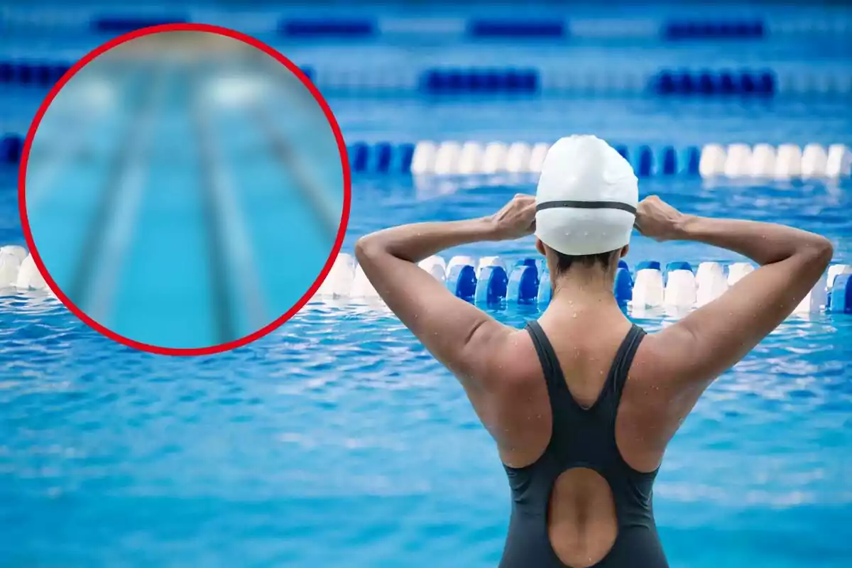 Una nedadora amb gorra de natació es prepara en una piscina amb carrils blaus i blancs.