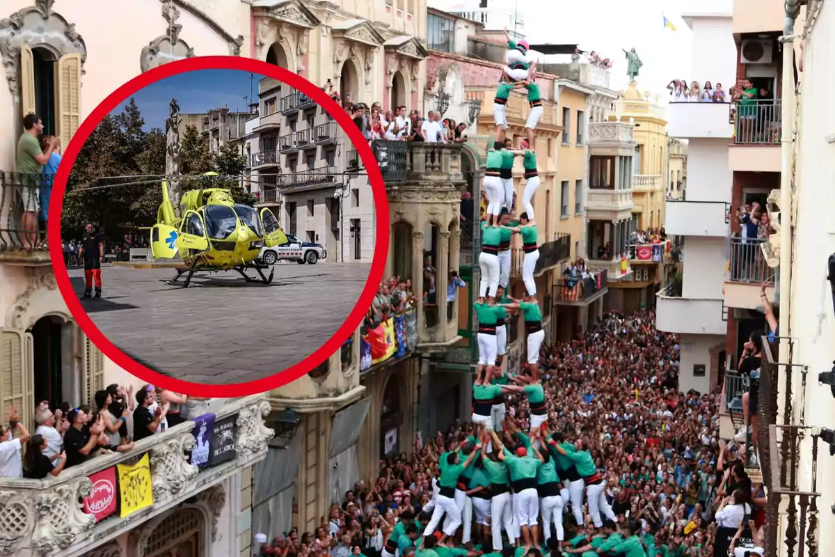 Una multitud observa des de balcons i el carrer mentre un grup de persones forma una torre humana en un esdeveniment tradicional, amb un helicòpter d'emergència destacat en un cercle vermell a la cantonada superior esquerra.