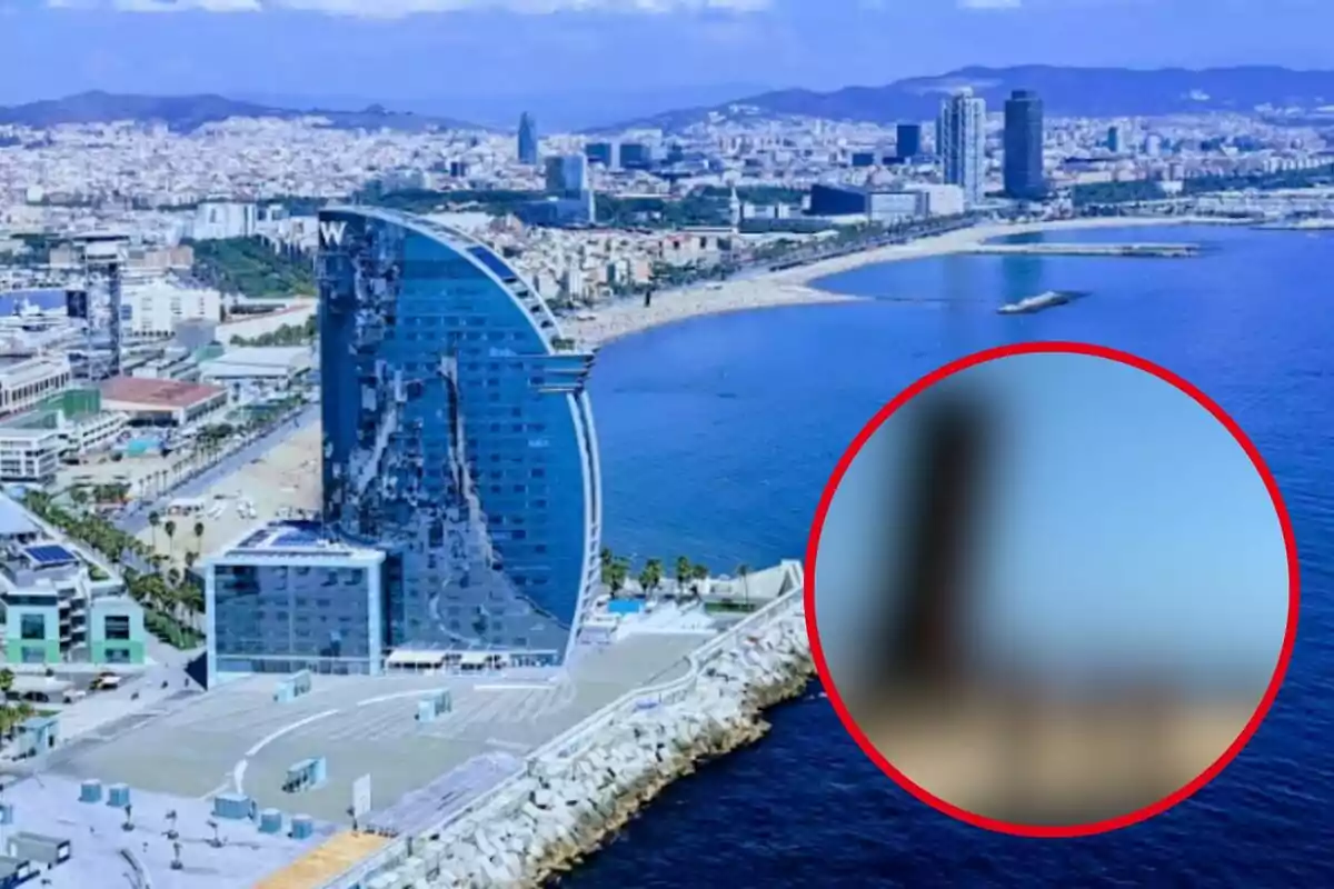 Imatge d´un edifici modern al costat del mar amb una secció borrosa en un cercle vermell.