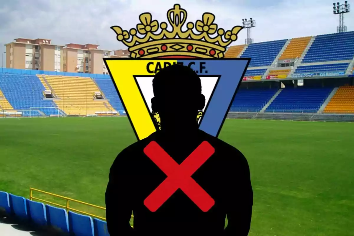 Silueta de una persona con una cruz roja sobrepuesta frente al escudo del Cádiz C.F. en un estadio de fútbol vacío.