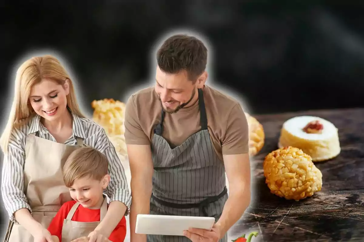 Una familia cocinando junta en la cocina mientras siguen una receta en una tableta con aperitivos en la mesa.