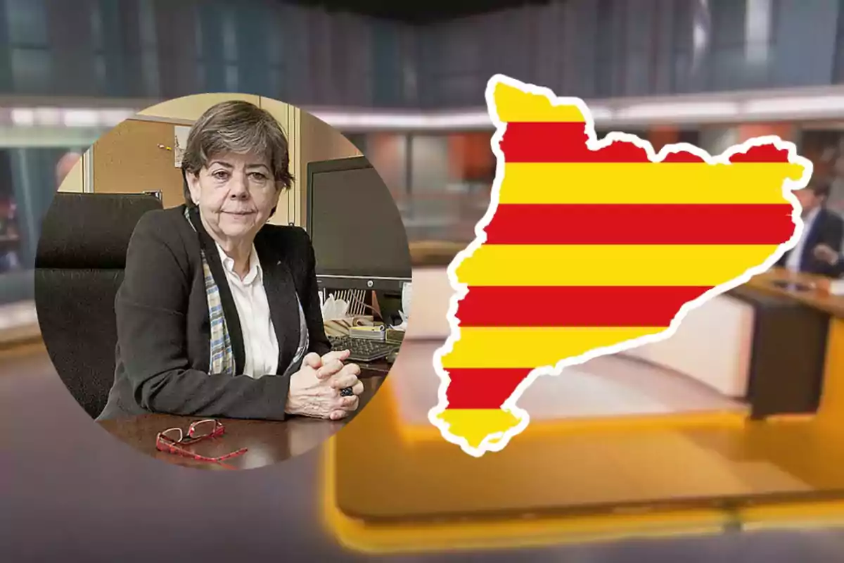 Una persona asseguda en una oficina al costat d'un gràfic de la regió de Catalunya amb les barres vermelles i grogues.