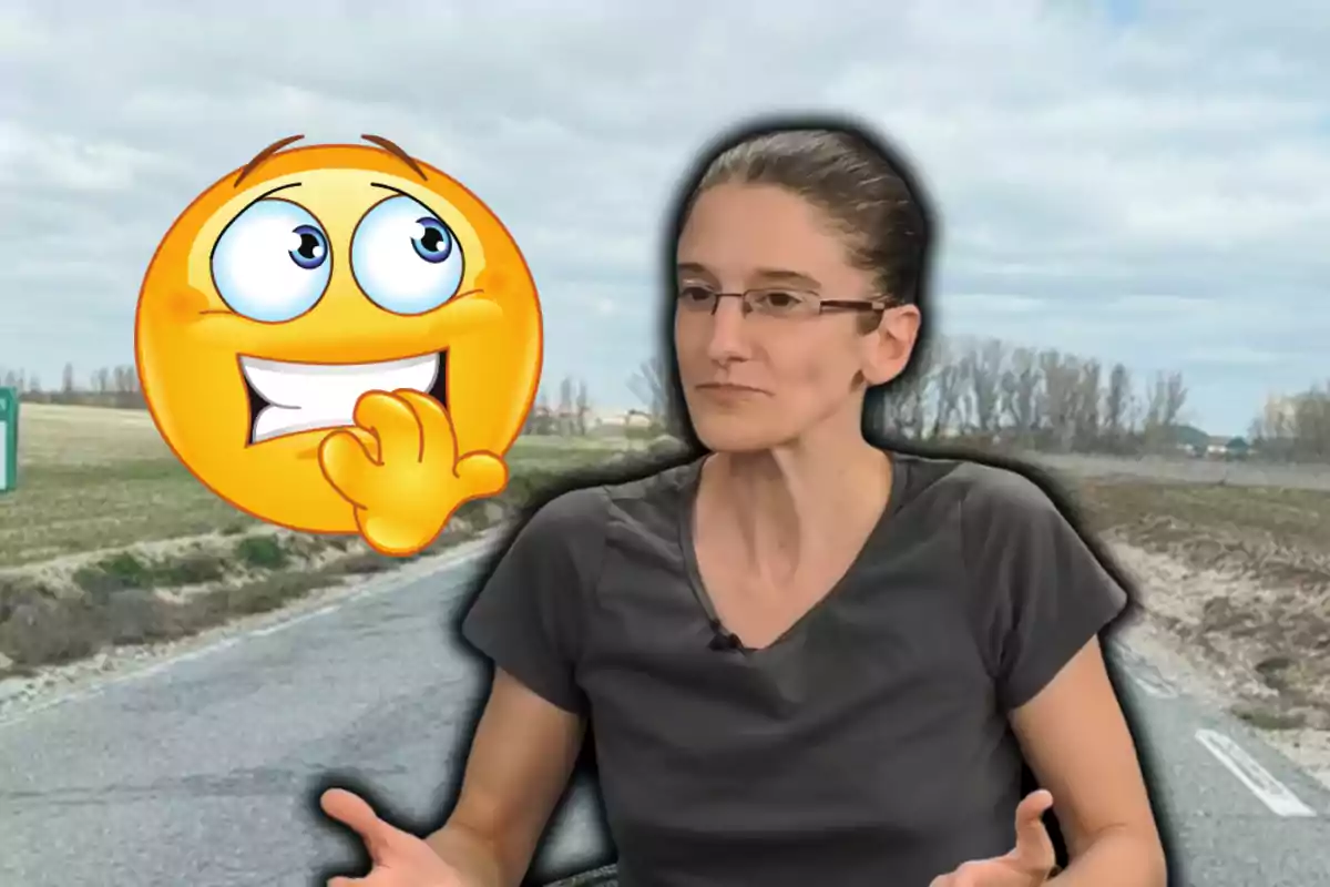 Woman with glasses and a gray t-jersey gesturing next to a nervous emoji on a rural road