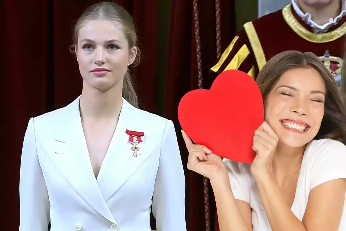 Una persona con traje blanco y medalla junto a una mujer sonriente sosteniendo un corazón rojo.