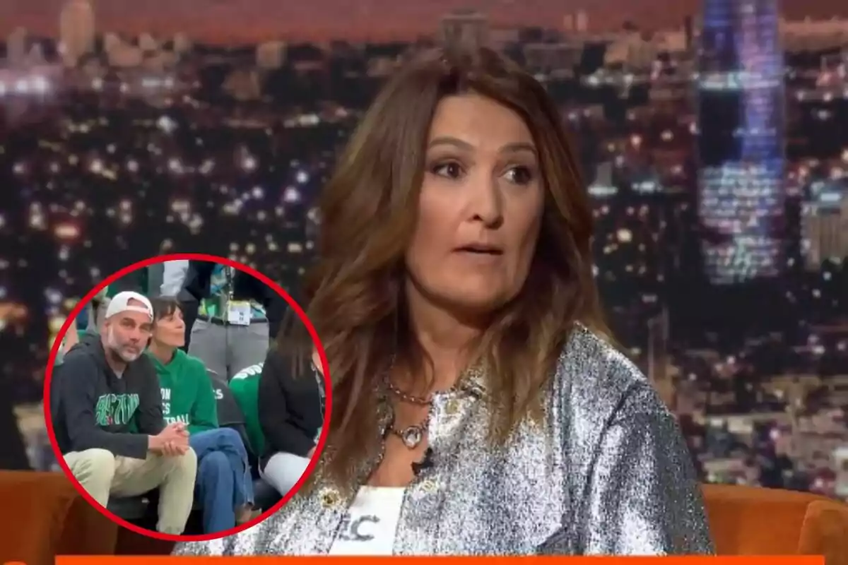 Una dona amb cabell castany apareix en un programa de televisió amb un fons de ciutat il·luminada i un requadre a la cantonada inferior esquerra mostra un home amb gorra blanca i dessuadora fosca assegut al costat d'una dona amb dessuadora verda.