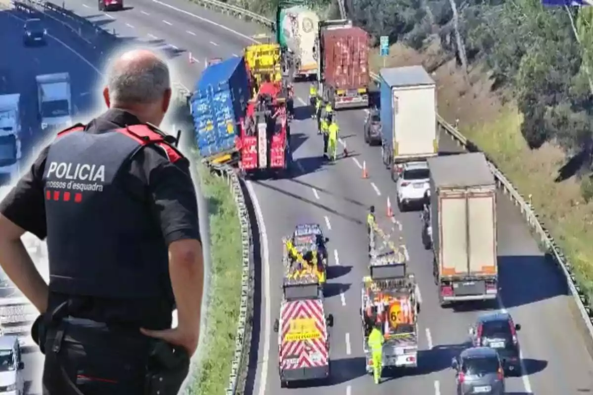 Un agent de policia observa una autopista on s'està duent a terme un operatiu de trànsit amb diversos camions i vehicles d'emergència presents.