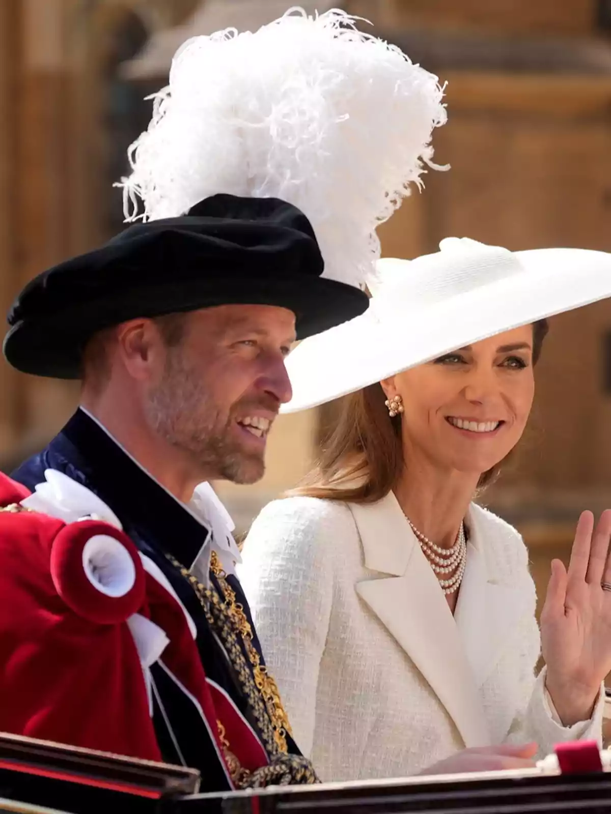 Prince William and Kate Middleton, elegantly dressed, attend a formal outdoor event; one of them is wearing a large white hat and the other a black hat with white feathers. Prince William and Kate Middleton, elegantly dressed, attend a formal outdoor event; one of them is wearing a large white hat and the other a black hat with white feathers.