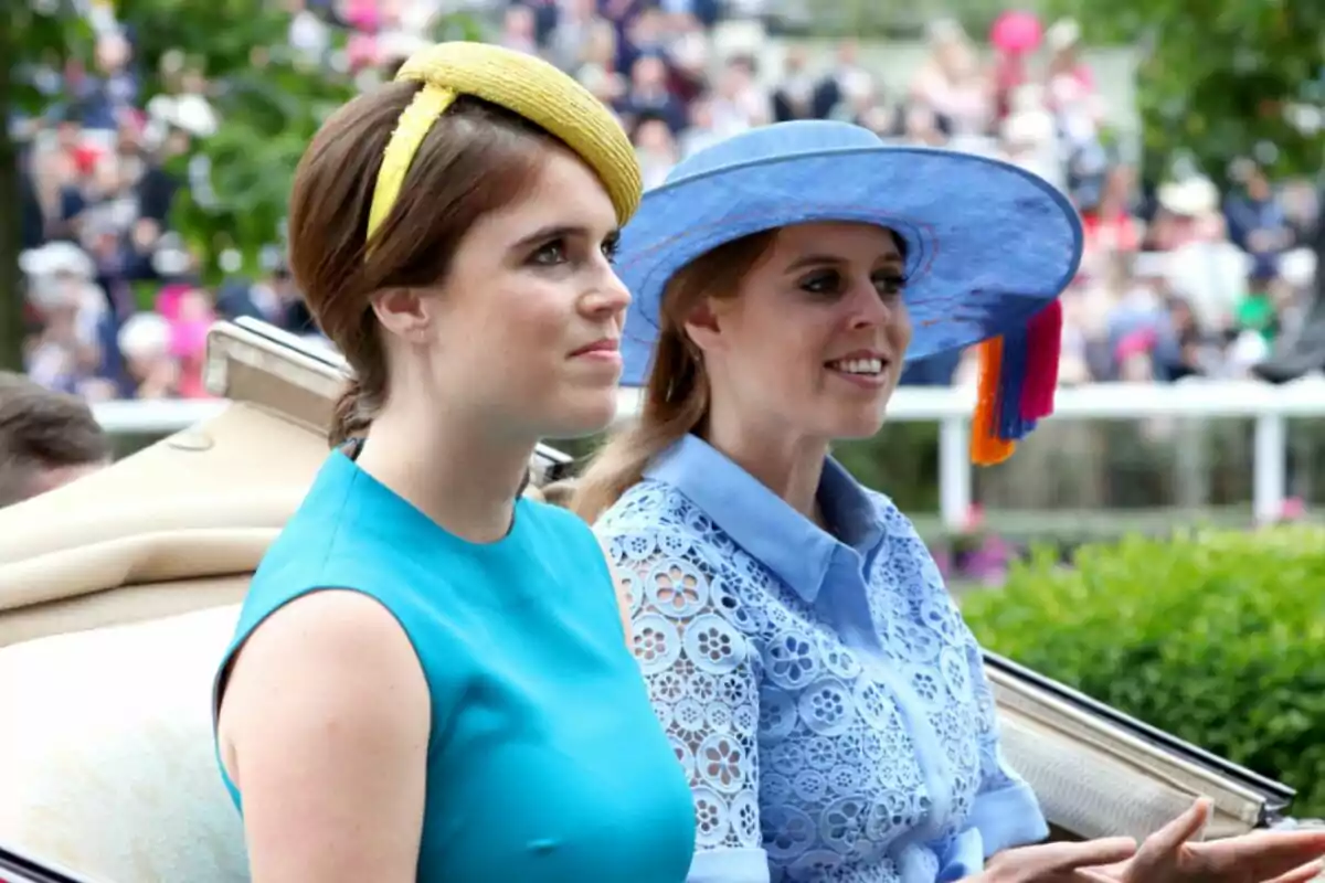 Princesses Eugenie and Beatrice elegantly dressed in colorful hats at an outdoor event. Princesses Eugenie and Beatrice elegantly dressed in colorful hats at an outdoor event.